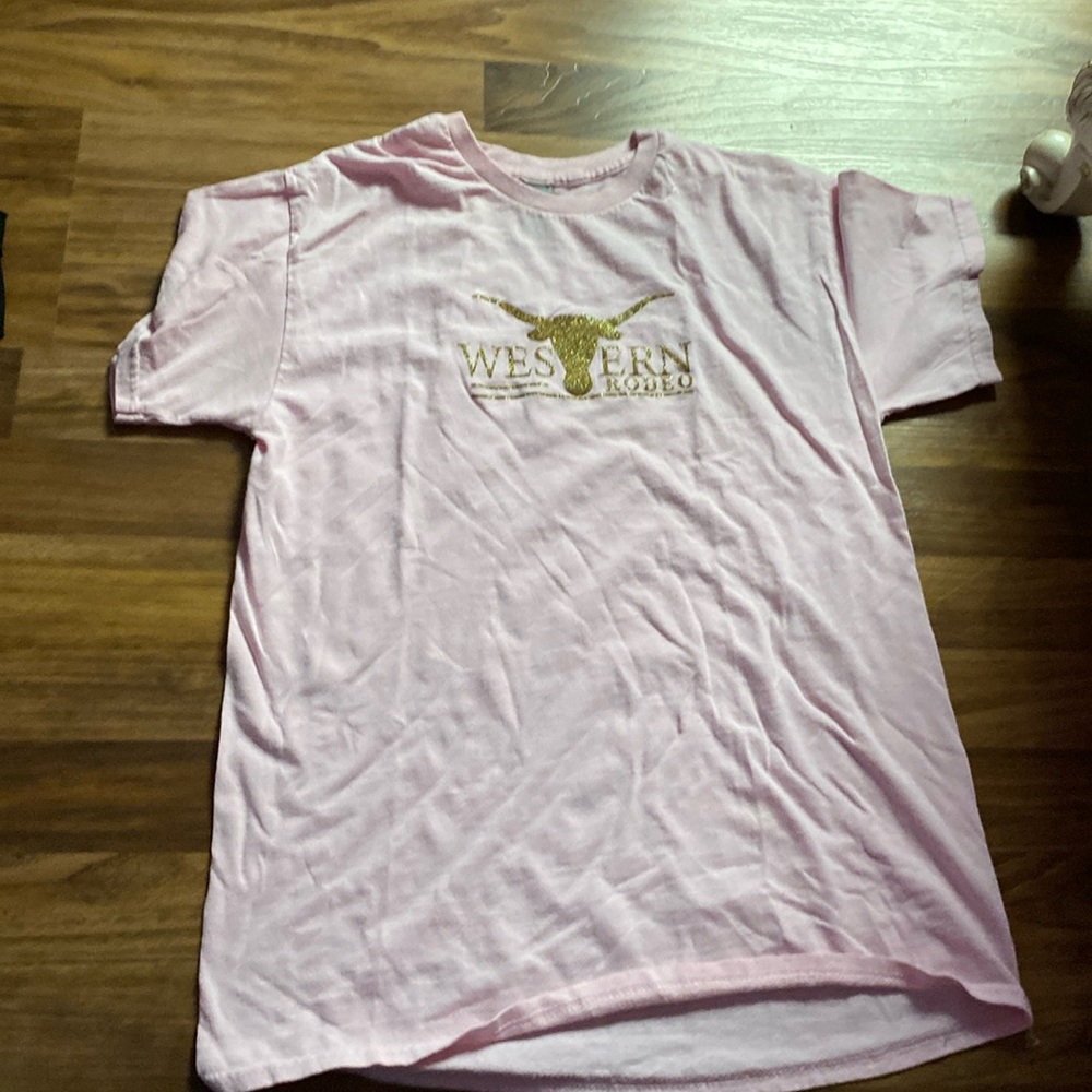 pink shirt with gold letters